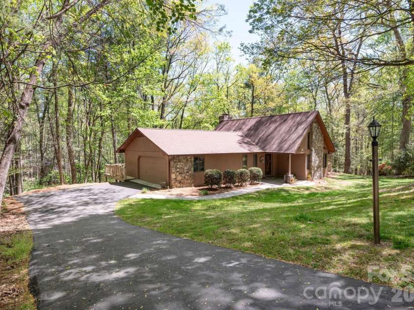 114 Timber Creek Road, Laurel Park, NC 28739.  MLS# CAR4371818, YatesRealty ID 14946. Over Half Acre Private Lot