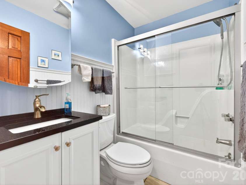 114 Timber Creek Road, Laurel Park, NC 28739.  MLS# CAR4371818, YatesRealty ID 14946. Renovated Hall Bathroom