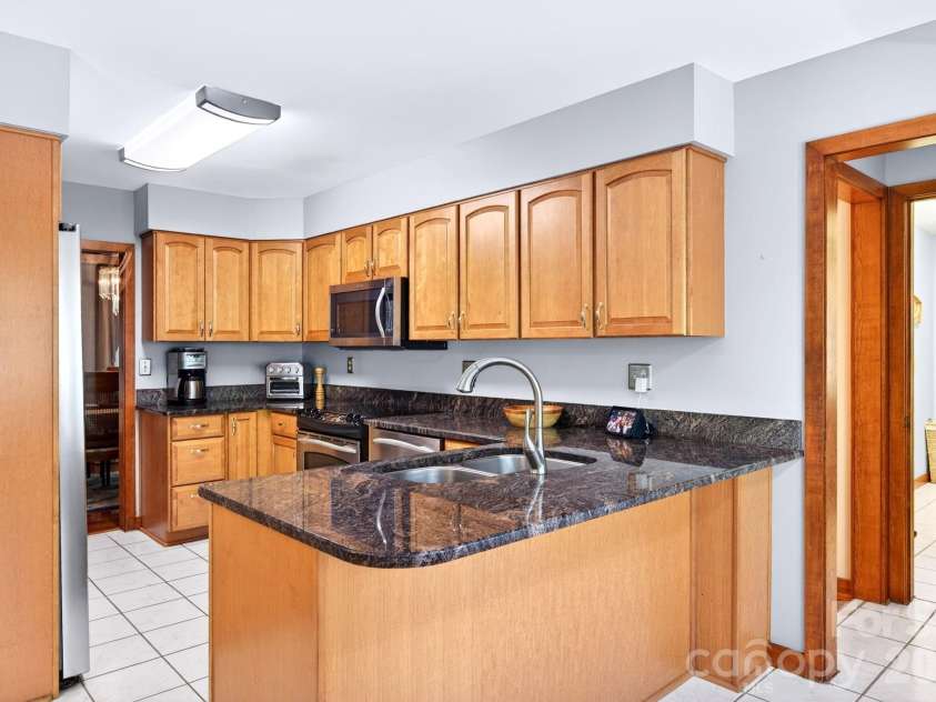114 Timber Creek Road, Laurel Park, NC 28739.  MLS# CAR4371818, YatesRealty ID 14946. Well-Appointed Kitchen