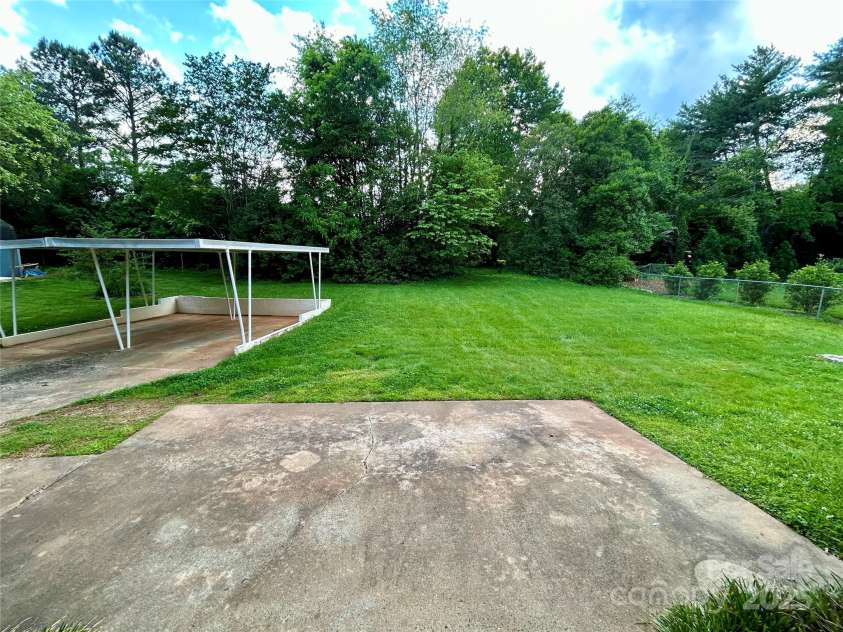 5734 Brookhaven Road, Charlotte, NC 28210.  MLS# CAR4260857, YatesRealty ID 14952. Rear Yard with patio & double carport