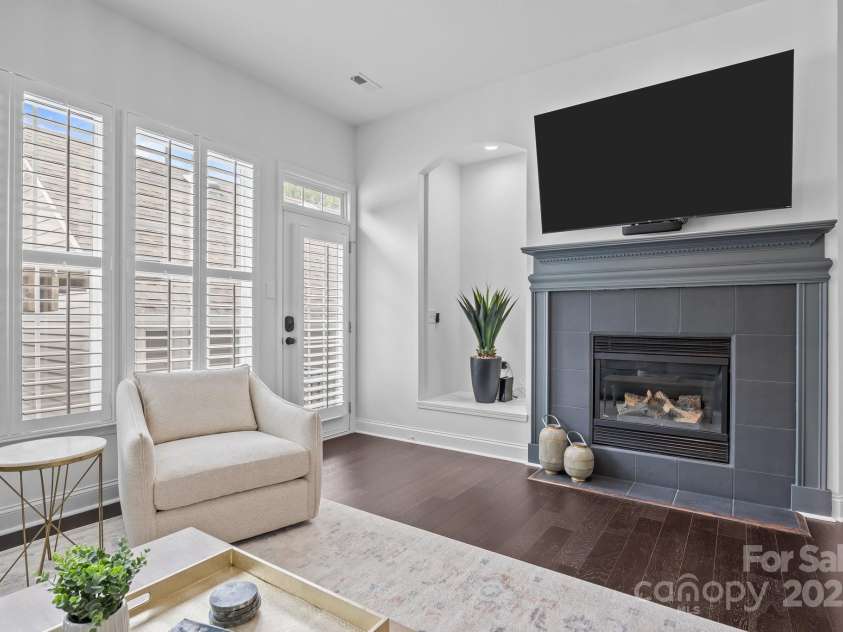 15913 Trenton Place Road, Huntersville, NC 28078.  MLS# CAR4259795, YatesRealty ID 14953. Gas fireplace with storage alcove to the left with dedicated ports for internet connections