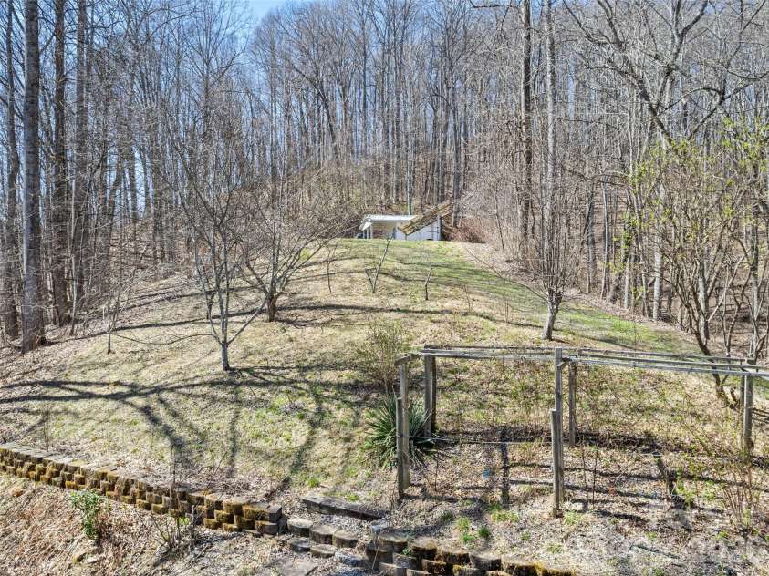 401 Tipstill Cove, Waynesville, NC 28786.  MLS# CAR4355703, YatesRealty ID 14966. Edible Landscaping, Solar Panel and Workshop