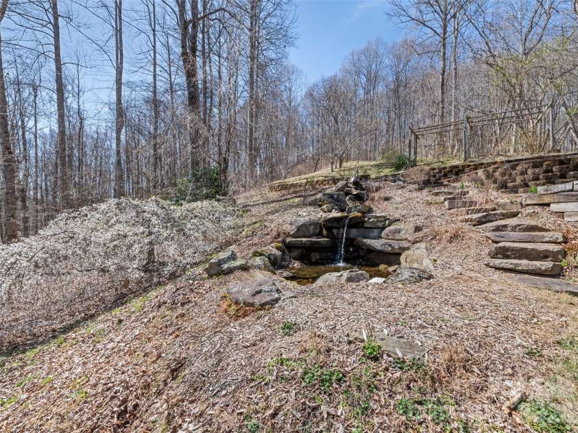 401 Tipstill Cove, Waynesville, NC 28786.  MLS# CAR4355703, YatesRealty ID 14966. Koi Pond and Waterfall