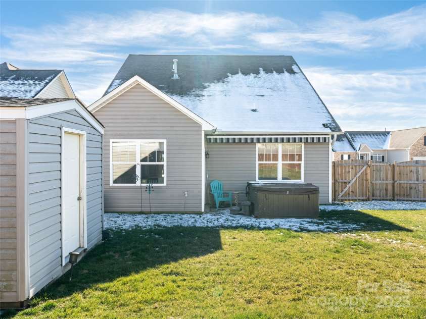 112 Pamlico Road, Fletcher, NC 28732.  MLS# CAR4215521, YatesRealty ID 14982. Back of home with storage building.