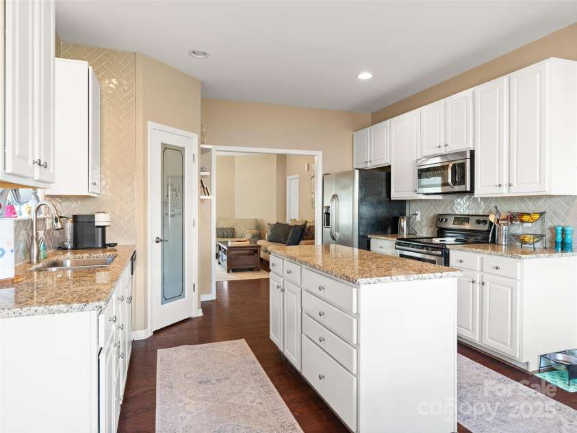 112 Pamlico Road, Fletcher, NC 28732.  MLS# CAR4215521, YatesRealty ID 14982. Custom herringbone tile work in the kitchen.