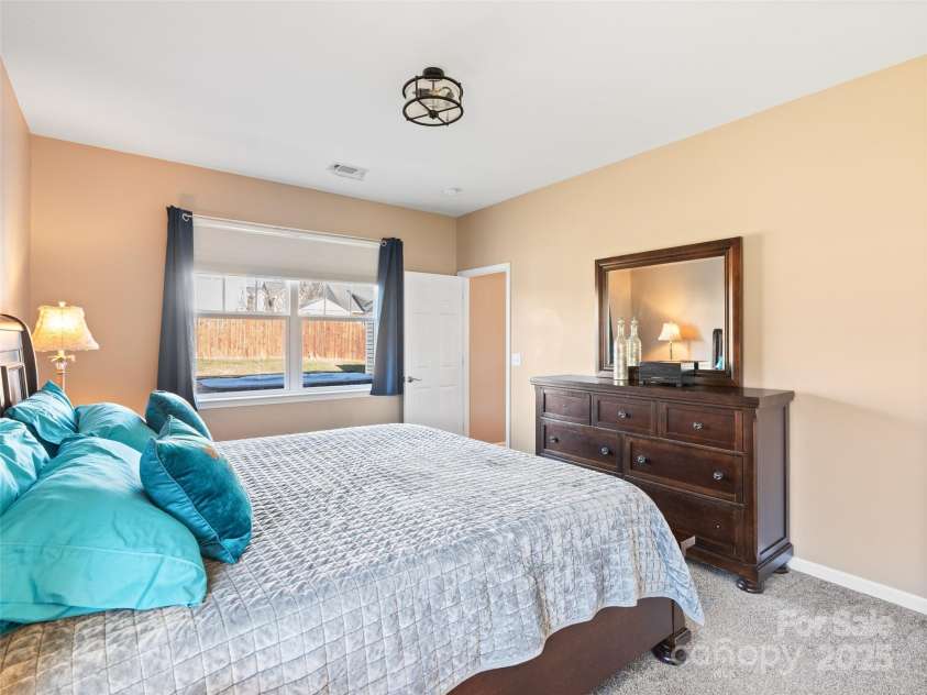 112 Pamlico Road, Fletcher, NC 28732.  MLS# CAR4215521, YatesRealty ID 14982. Primary bedroom looks out to fenced backyard.