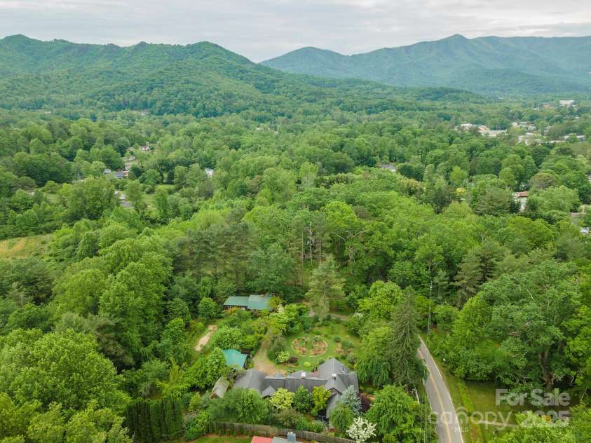 528 Padgettown Road, Black Mountain, NC 28711.  MLS# CAR4261507, YatesRealty ID 1499. Aerial views of property and surrounding mountain. 