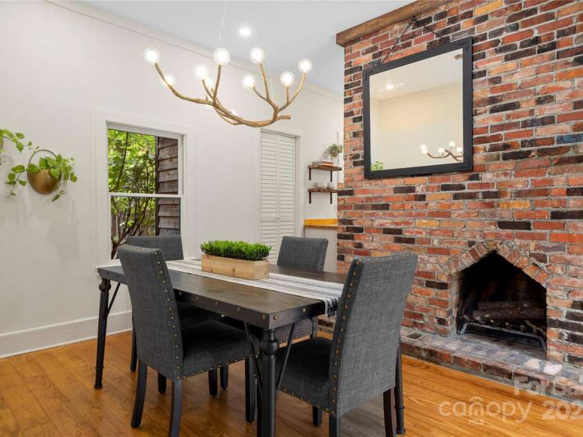 528 Padgettown Road, Black Mountain, NC 28711.  MLS# CAR4261507, YatesRealty ID 1499. Dining Room with brick fireplace