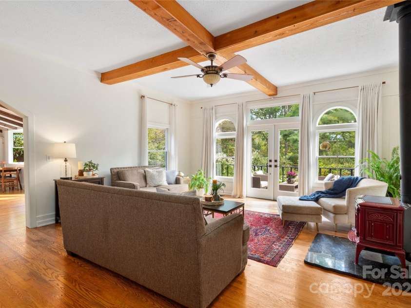 528 Padgettown Road, Black Mountain, NC 28711.  MLS# CAR4261507, YatesRealty ID 1499. Living Room-French doors that open to the wrap around deck.