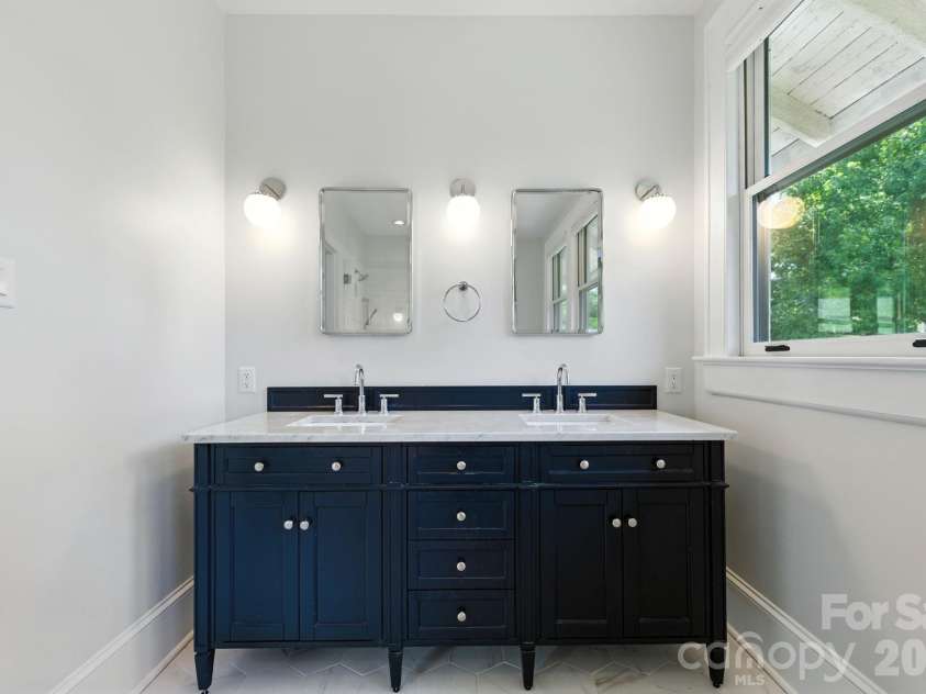 38 Austin Avenue, Asheville, NC 28801.  MLS# CAR4364938, YatesRealty ID 14994. Double vanity with new fixtures and marble countertops