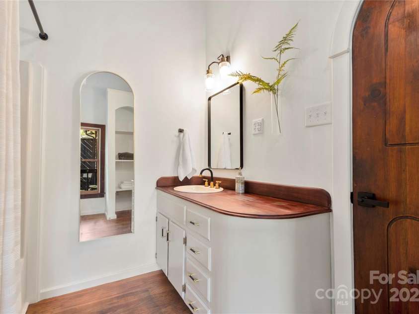 528 Padgettown Road, Black Mountain, NC 28711.  MLS# CAR4261507, YatesRealty ID 14998. Primary Suite Bath with custom vanity and newer fixtures.