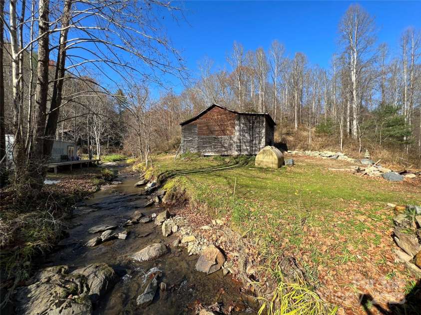 23 Katies Road, Marshall, NC 28753.  MLS# CAR4203088, YatesRealty ID 1501. Paw Paw Creek and ol barn.  