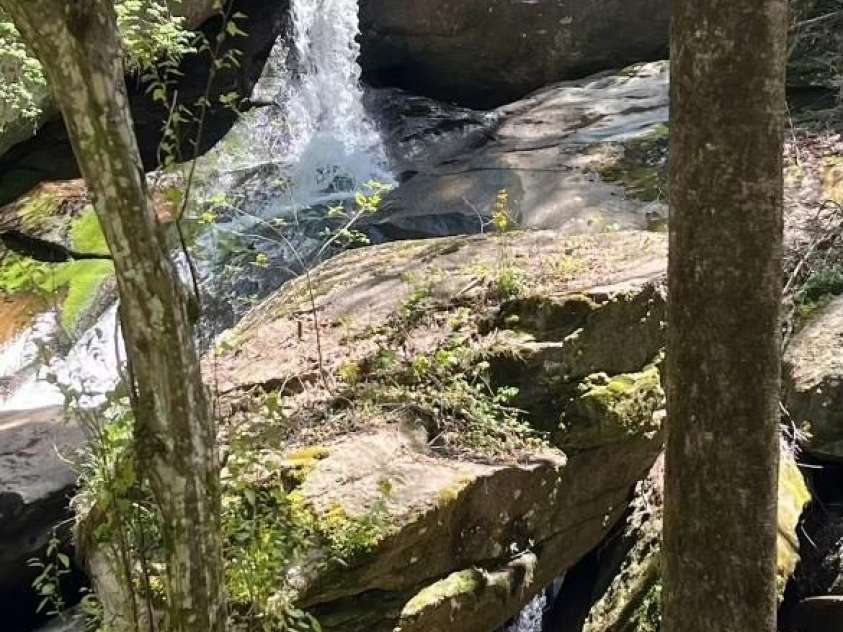 23 Katies Road, Marshall, NC 28753.  MLS# CAR4203088, YatesRealty ID 1501. Seller Picture.  Right time of the day Light shines on cave waterfall.  You can't make this stuff up.  