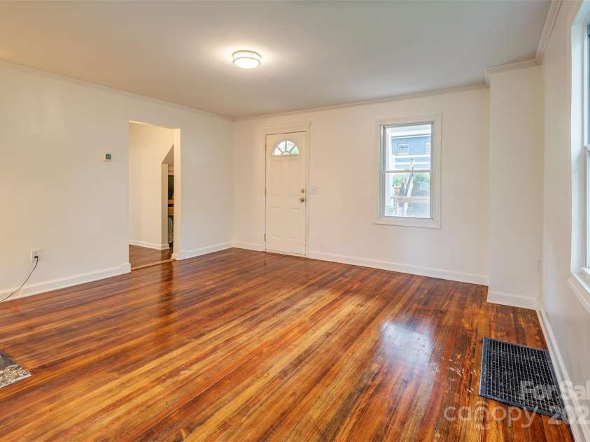 9 North Street, Weaverville, NC 28787.  MLS# CAR4255225, YatesRealty ID 15016. Living Room (looking towards the front door)