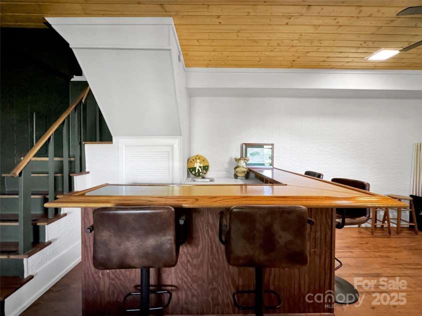 80 Hidden Falls Road, Maggie Valley, NC 28751.  MLS# CAR4259710, YatesRealty ID 15017. Basement bar & game room