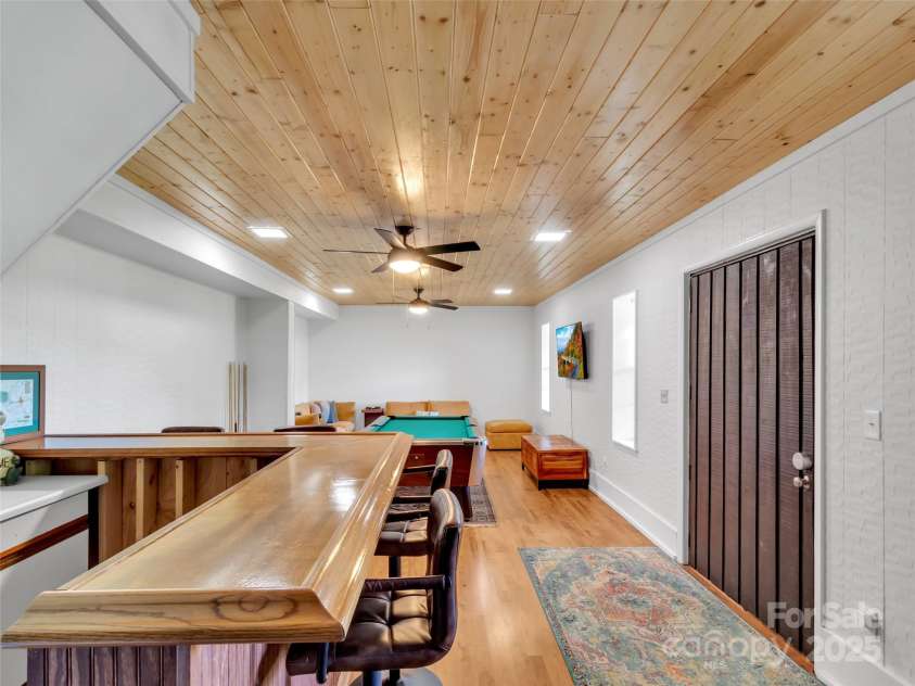 80 Hidden Falls Road, Maggie Valley, NC 28751.  MLS# CAR4259710, YatesRealty ID 15017. Basement game room