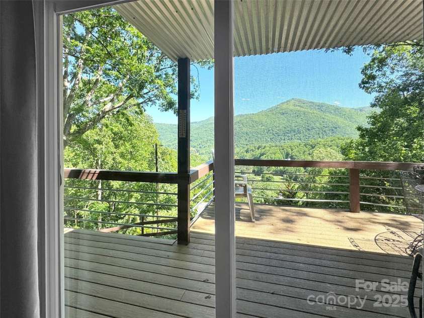 80 Hidden Falls Road, Maggie Valley, NC 28751.  MLS# CAR4259710, YatesRealty ID 15017. Deck views