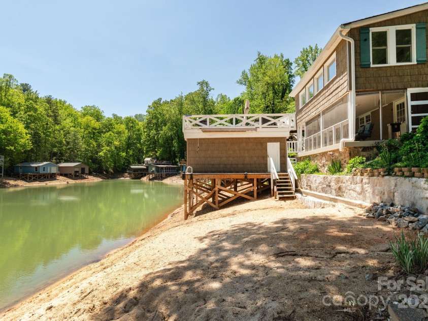 386 Charlotte Drive, Lake Lure, NC 28746.  MLS# CAR4243740, YatesRealty ID 15020. Boathouse fits a pontoon boat perfectly.