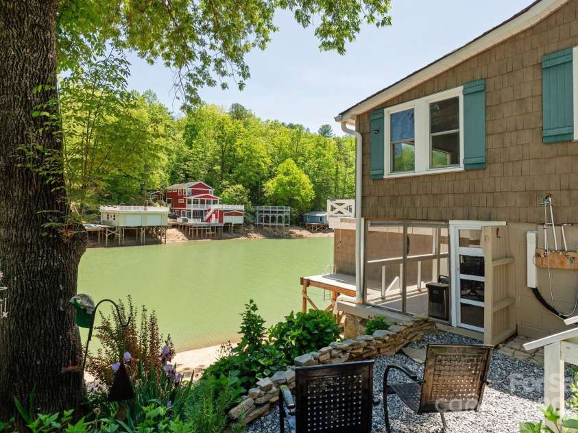 386 Charlotte Drive, Lake Lure, NC 28746.  MLS# CAR4243740, YatesRealty ID 15020. Lower Level: Screened porch and outdoor shower