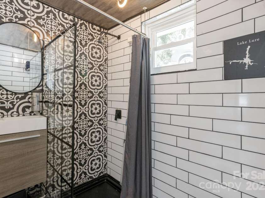 386 Charlotte Drive, Lake Lure, NC 28746.  MLS# CAR4243740, YatesRealty ID 15020. Main Level: Bathroom