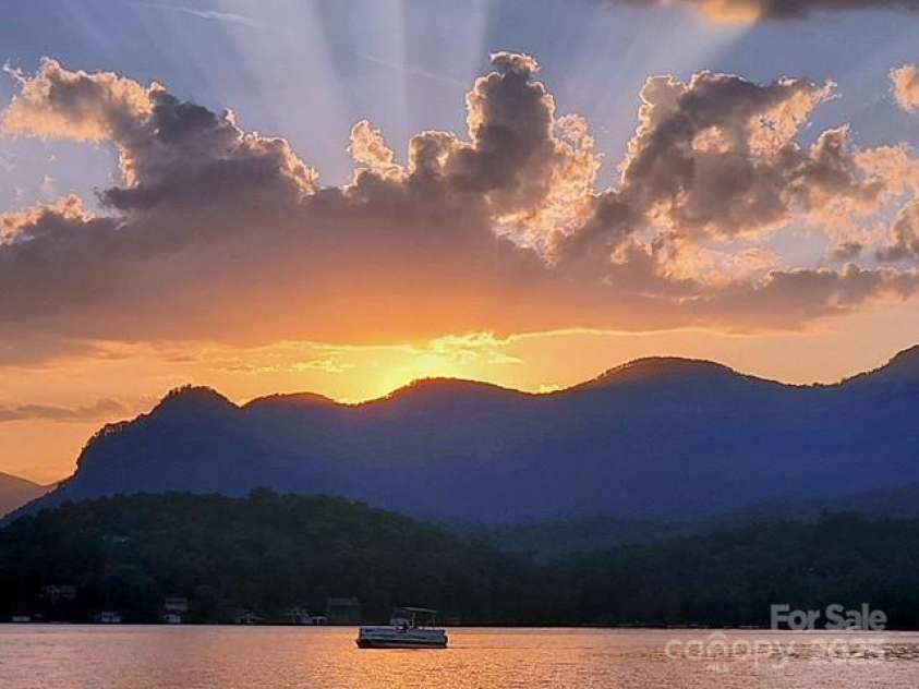 386 Charlotte Drive, Lake Lure, NC 28746.  MLS# CAR4243740, YatesRealty ID 15020. Stellar Lake Lure sunset