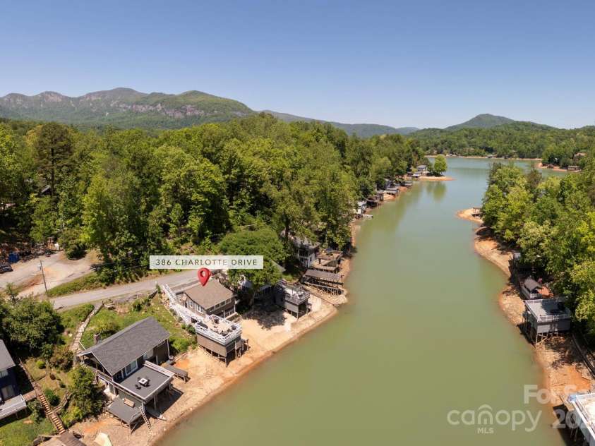 386 Charlotte Drive, Lake Lure, NC 28746.  MLS# CAR4243740, YatesRealty ID 15020. Terrific mountain views from the water, and a drone!