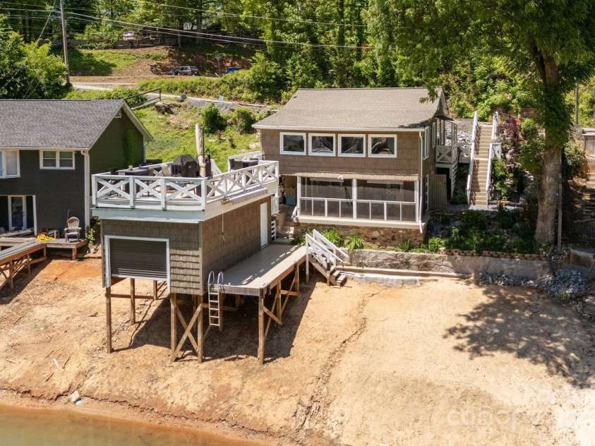 386 Charlotte Drive, Lake Lure, NC 28746.  MLS# CAR4243740, YatesRealty ID 15020. The photographer is really not this tall. Image created by a drone.