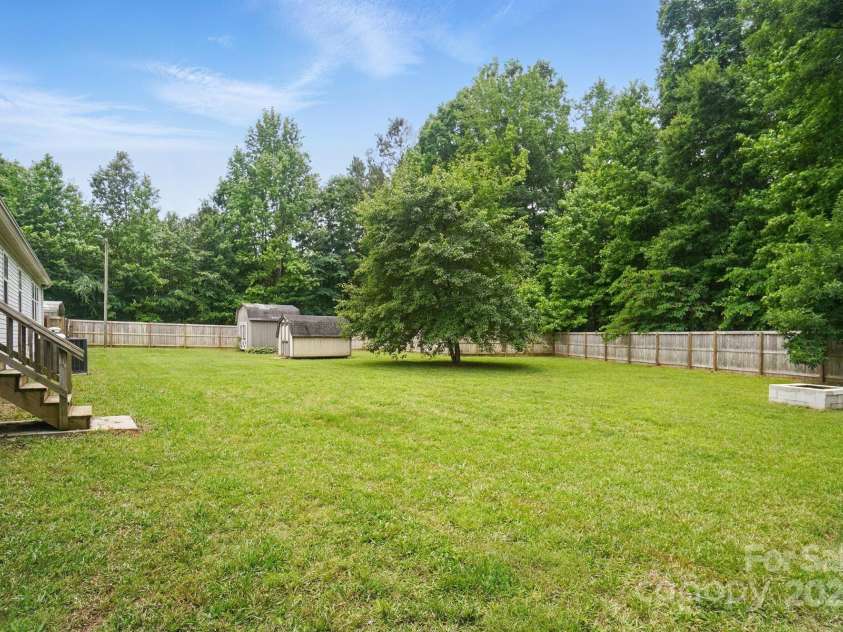 12382 Ritchie Road, Midland, NC 28107.  MLS# CAR4258214, YatesRealty ID 15036. Fenced Back Yard