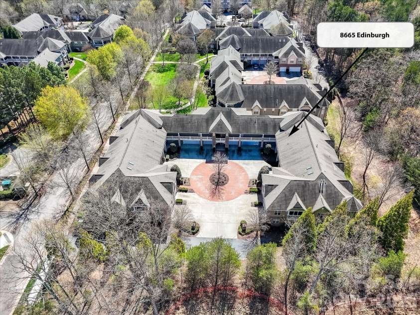 8665 Edinburgh Square Drive, Cornelius, NC 28031.  MLS# CAR4357240, YatesRealty ID 15038. Aerial view highlighting the unit’s prime location within a beautifully maintained community centered around a charming courtyard.