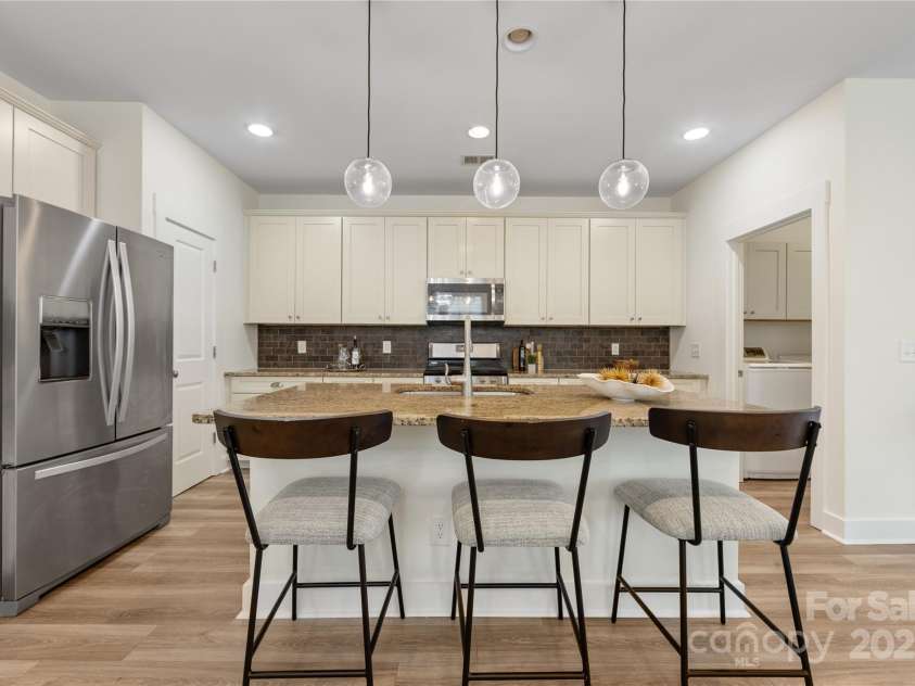 2638 Double Oaks Road, Charlotte, NC 28206.  MLS# CAR4252717, YatesRealty ID 15041. Bar seating is perfect for watching the chef or doing homework under a watchful eye!