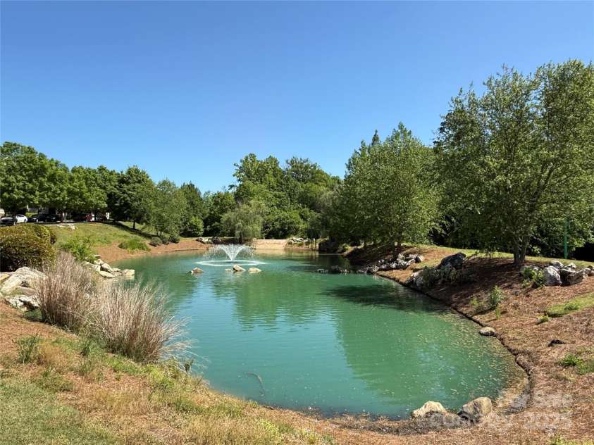2638 Double Oaks Road, Charlotte, NC 28206.  MLS# CAR4252717, YatesRealty ID 15041. Residents and visitors alike enjoy this pond with fountain year-round.