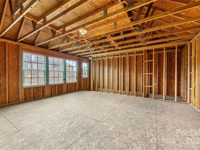 2638 Double Oaks Road, Charlotte, NC 28206.  MLS# CAR4252717, YatesRealty ID 15041. This unfinished space above the garage offers 492 SF of possibilities.  Neighbors have transformed this type of space into an income-producing apartment.  You could also complete the space for a studio, office or nan