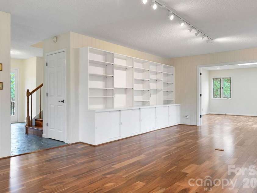 400 Middle Connestee Trail, Brevard, NC 28712.  MLS# CAR4354726, YatesRealty ID 15049. Den built-ins