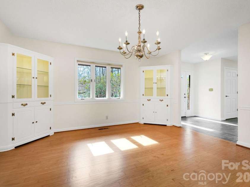 400 Middle Connestee Trail, Brevard, NC 28712.  MLS# CAR4354726, YatesRealty ID 15049. Dining room & built-ins