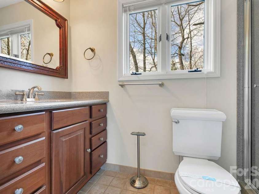 400 Middle Connestee Trail, Brevard, NC 28712.  MLS# CAR4354726, YatesRealty ID 15049. Lower main bath