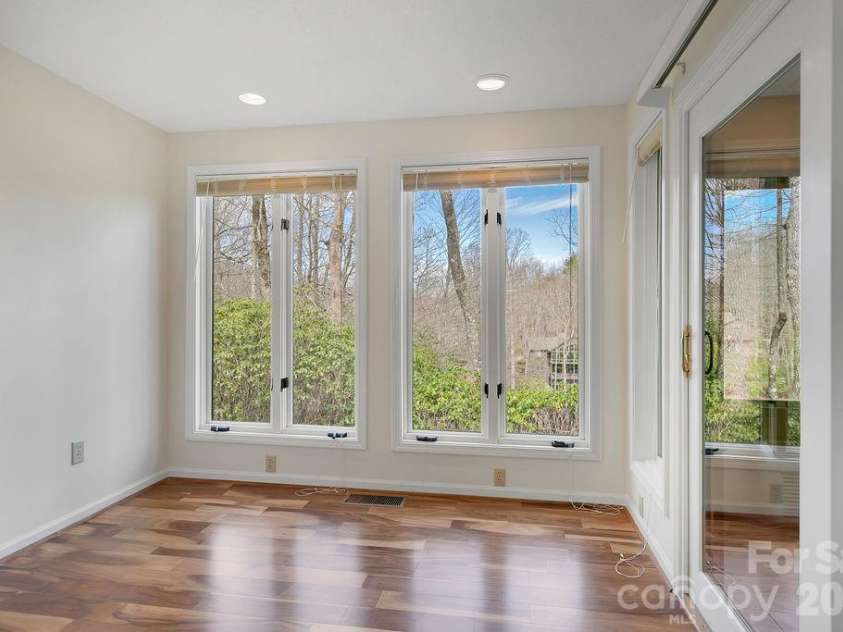 400 Middle Connestee Trail, Brevard, NC 28712.  MLS# CAR4354726, YatesRealty ID 15049. Lower main bedroom sitting area