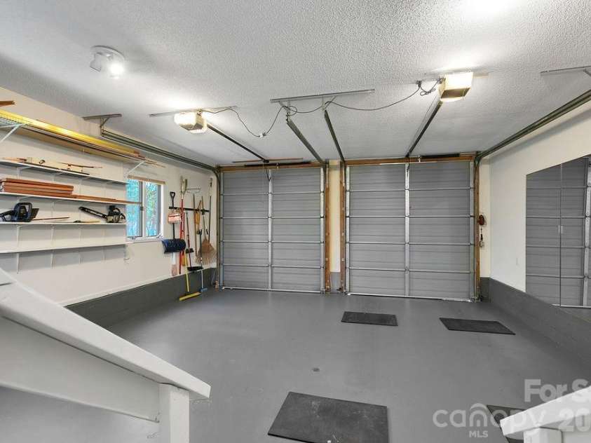 400 Middle Connestee Trail, Brevard, NC 28712.  MLS# CAR4354726, YatesRealty ID 15049. Oversize garage for those recreational vehicles!