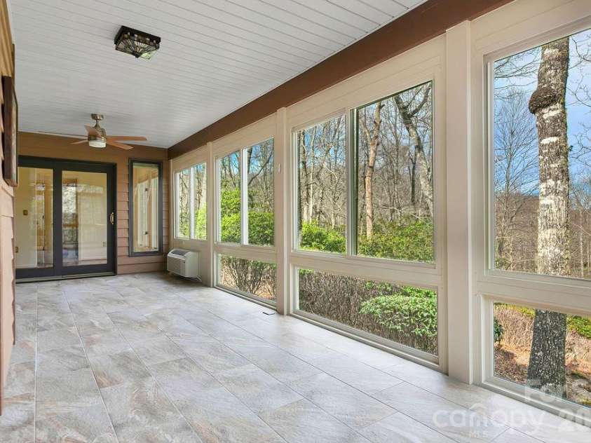 400 Middle Connestee Trail, Brevard, NC 28712.  MLS# CAR4354726, YatesRealty ID 15049. Sun porch