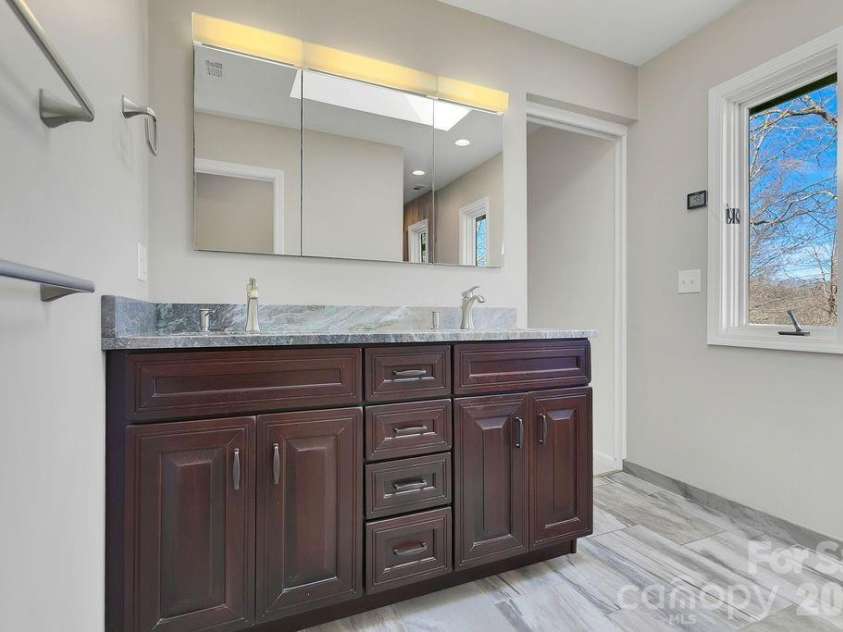 400 Middle Connestee Trail, Brevard, NC 28712.  MLS# CAR4354726, YatesRealty ID 15049. Upper main bath with heated floors