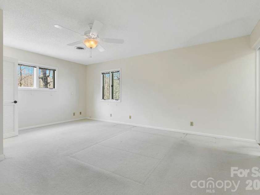 400 Middle Connestee Trail, Brevard, NC 28712.  MLS# CAR4354726, YatesRealty ID 15049. Upper main bedroom