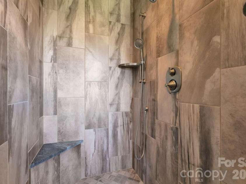 400 Middle Connestee Trail, Brevard, NC 28712.  MLS# CAR4354726, YatesRealty ID 15049. Upper main custom walk-in shower