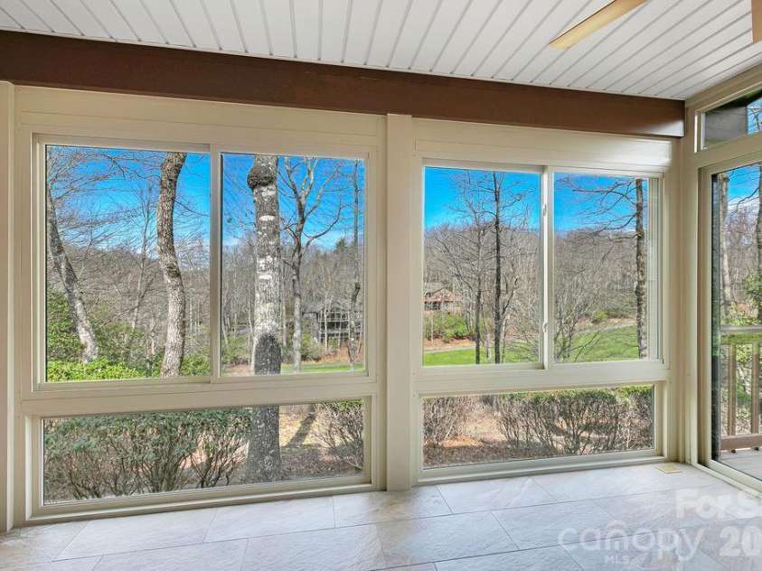 400 Middle Connestee Trail, Brevard, NC 28712.  MLS# CAR4354726, YatesRealty ID 15049. View from sun porch