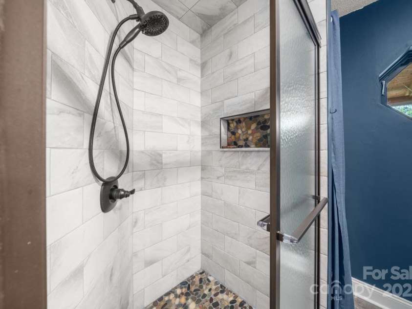 102 Jody Street, East Flat Rock, NC 28726.  MLS# CAR4241091, YatesRealty ID 15050. Down Stairs Bathroom