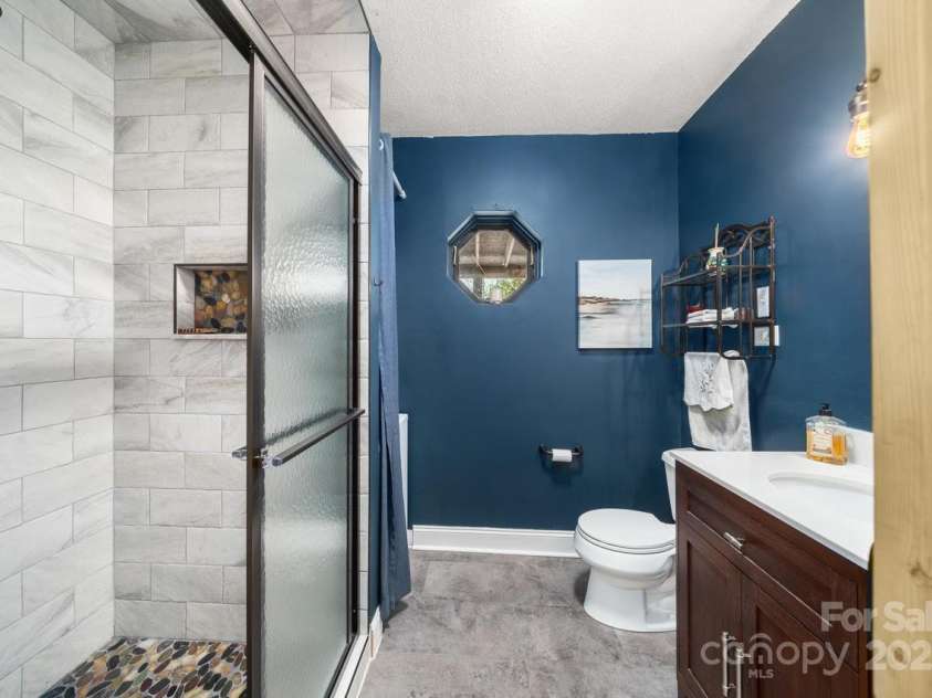 102 Jody Street, East Flat Rock, NC 28726.  MLS# CAR4241091, YatesRealty ID 15050. Down Stairs Bathroom