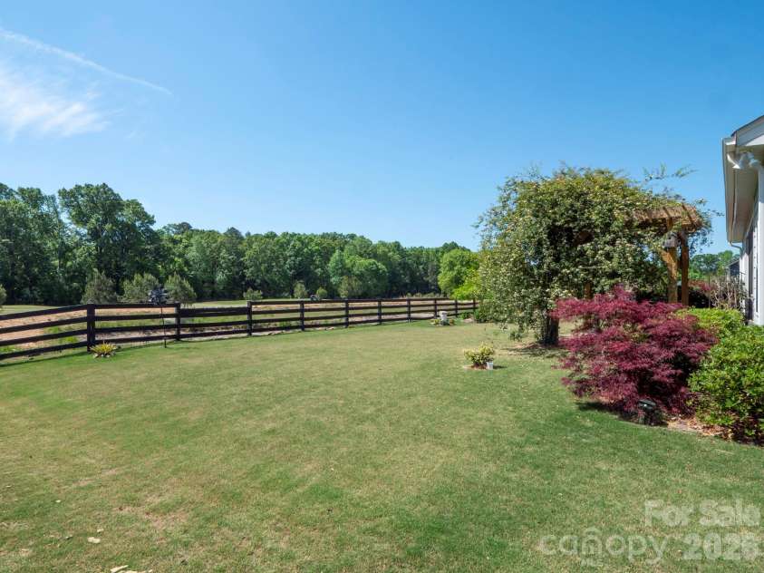 4303 Bent Green Lane, Monroe, NC 28112.  MLS# CAR4351446, YatesRealty ID 15056. Golf Course View From Backyard