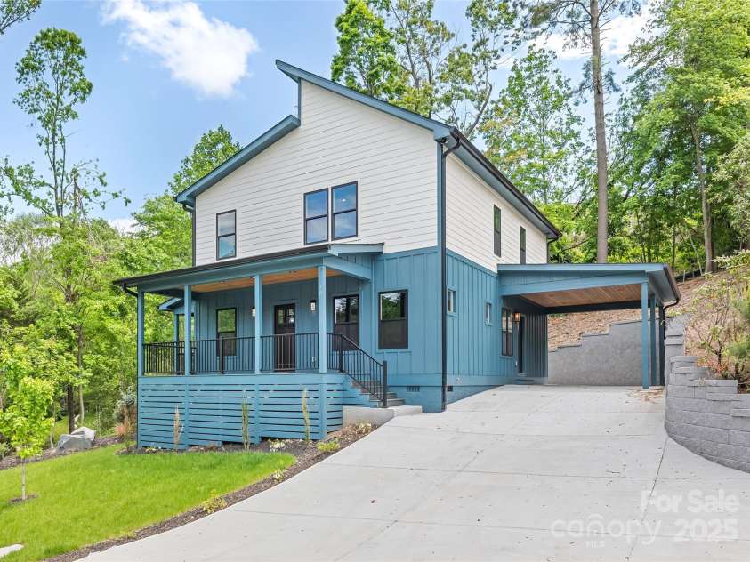 18 Winterhawk Drive, Arden, NC 28704.  MLS# CAR4255813, YatesRealty ID 15058. Rocking Chair Front Porch