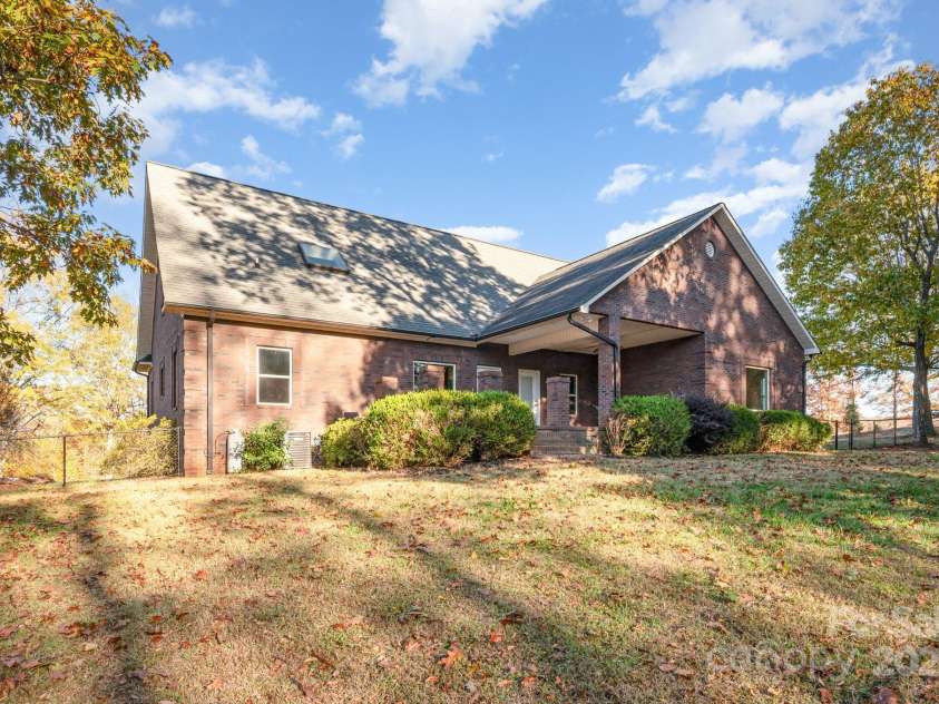 182 Canal Drive, Statesville, NC 28677.  MLS# CAR4318839, YatesRealty ID 1506. Back of home, lake side