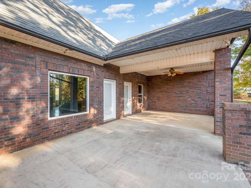 182 Canal Drive, Statesville, NC 28677.  MLS# CAR4318839, YatesRealty ID 1506. Back patio
