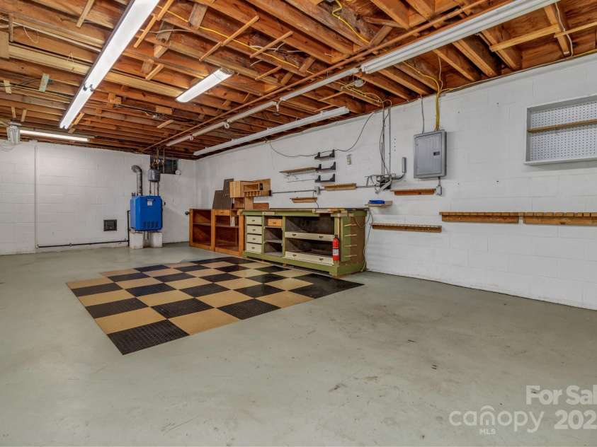 8 Chunns View Drive, Asheville, NC 28805.  MLS# CAR4258237, YatesRealty ID 15062. Workshop area on lower level