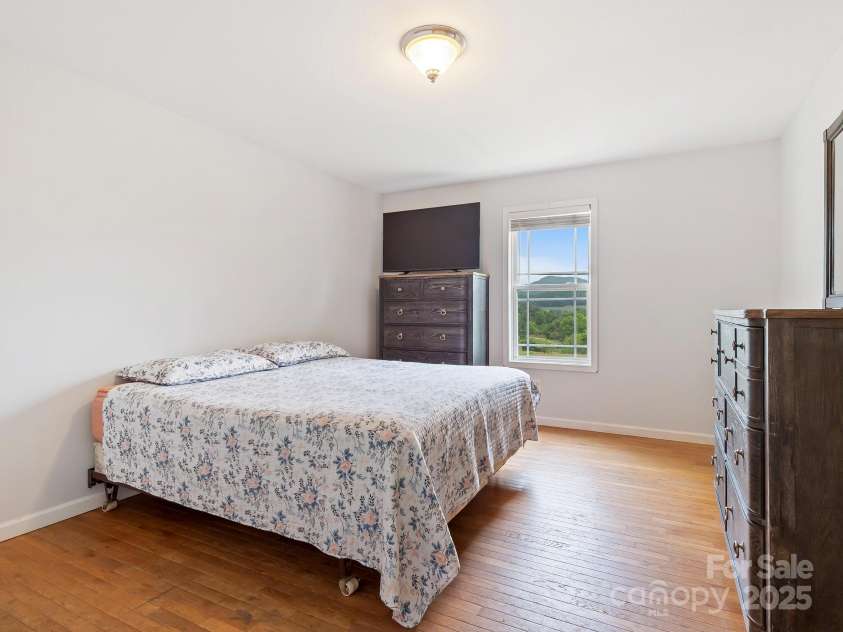 618 Enka Lake Road, Candler, NC 28715.  MLS# CAR4260345, YatesRealty ID 15064. Ensuite Primary bedroom with views